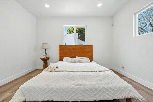 14581460 W 80th St, Los Angeles, CA 90047 - bedroom with multiple windows, recessed lighting, and light wood-type flooring