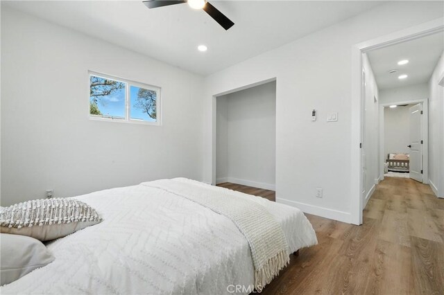 14581460 W 80th St, Los Angeles, CA 90047 - bedroom with wood finished floors, recessed lighting, and ceiling fan