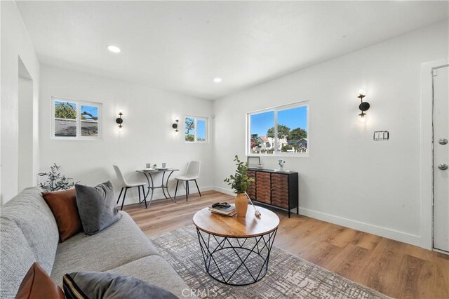 14581460 W 80th St, Los Angeles, CA 90047 - living area featuring healthy amount of natural light, light wood-style flooring, and recessed lighting