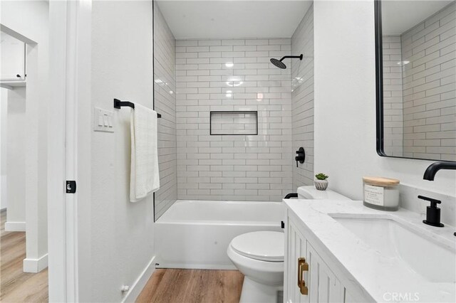 14581460 W 80th St, Los Angeles, CA 90047 - full bathroom with wood finished floors, vanity, and washtub / shower combination