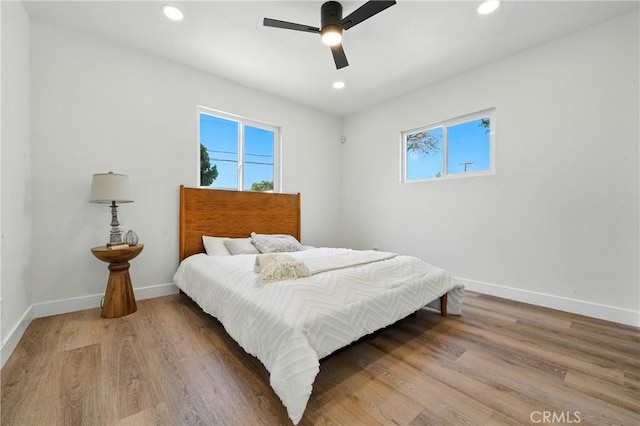 14581460 W 80th St, Los Angeles, CA 90047 - bedroom with multiple windows, wood finished floors, recessed lighting, and ceiling fan