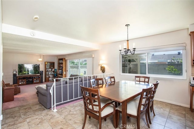 14772 Forrest Ln, Westminster, CA 92683 - dining space featuring a chandelier and baseboards