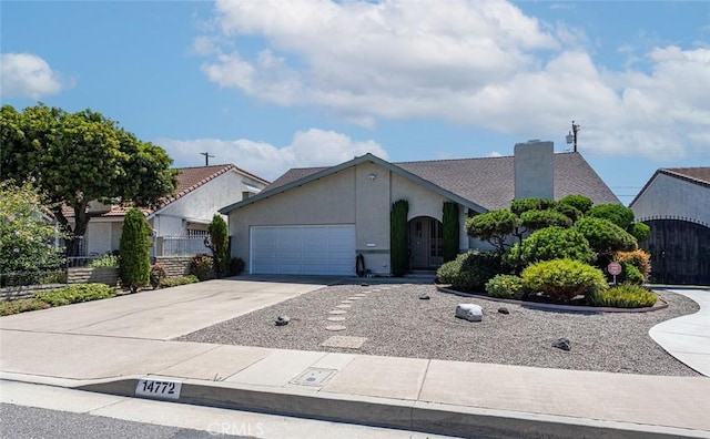 14772 Forrest Ln, Westminster, CA 92683 - ranch-style house with a garage, concrete driveway, and stucco siding