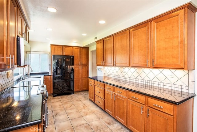 14772 Forrest Ln, Westminster, CA 92683 - kitchen with black refrigerator with ice dispenser, brown cabinets, backsplash, recessed lighting, and dark stone counters
