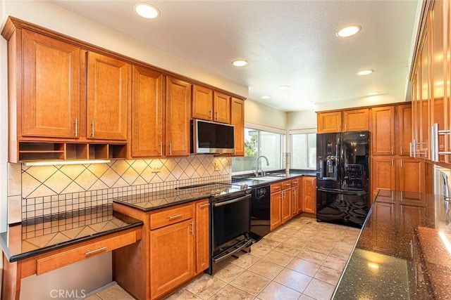 14772 Forrest Ln, Westminster, CA 92683 - kitchen with black appliances, brown cabinets, dark stone countertops, recessed lighting, and tasteful backsplash
