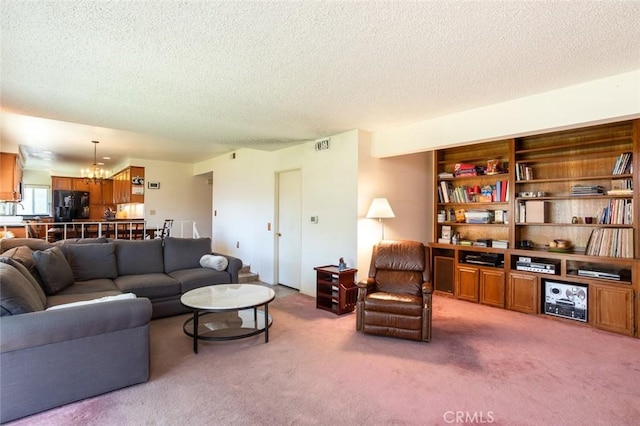 14772 Forrest Ln, Westminster, CA 92683 - living room featuring a textured ceiling, carpet floors, and a chandelier