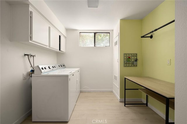 680 E Workman St, Covina, CA 91723 - laundry area with cabinet space, light wood-style floors, and washer and dryer