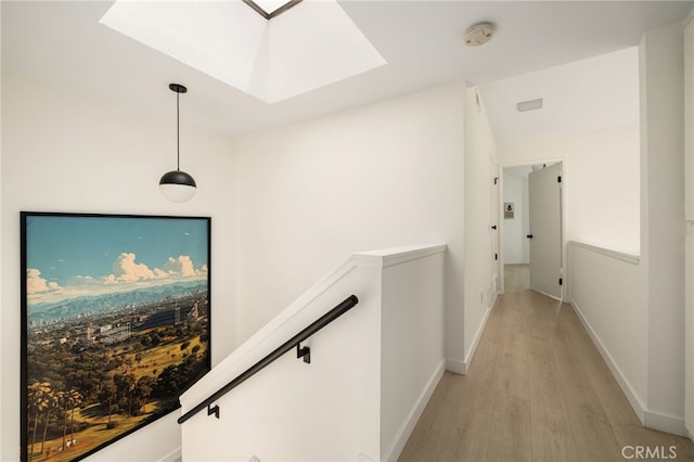 680 E Workman St, Covina, CA 91723 - corridor with a skylight, light wood-style floors, and an upstairs landing