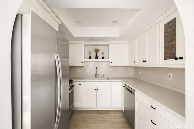 680 E Workman St, Covina, CA 91723 - kitchen with stainless steel appliances, open shelves, white cabinets, and light countertops