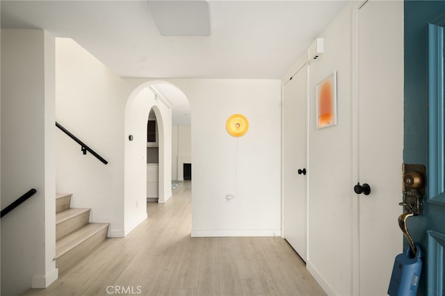 680 E Workman St, Covina, CA 91723 - hallway with light wood-style floors, arched walkways, and stairway