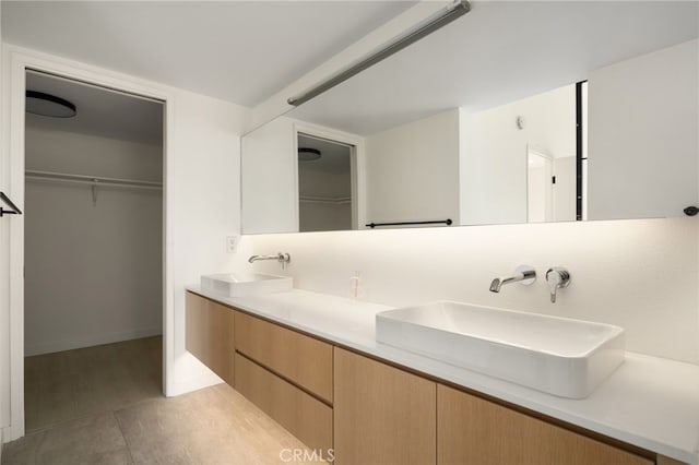 680 E Workman St, Covina, CA 91723 - full bathroom with double vanity and a walk in closet