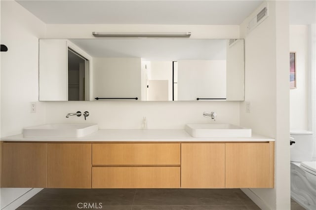 680 E Workman St, Covina, CA 91723 - bathroom featuring toilet and double vanity