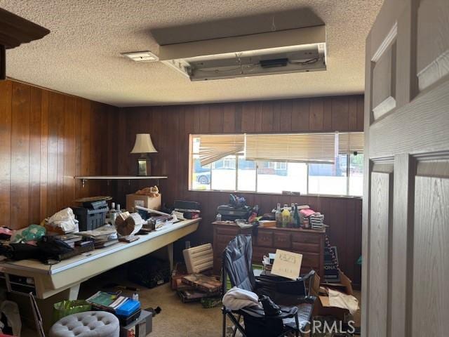 2089 Monterey Peninsula Dr, Corona, CA 92882 - office featuring a textured ceiling, wooden walls, and carpet