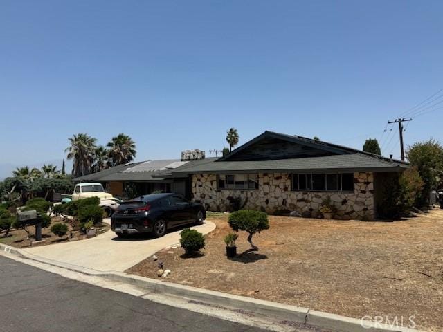 2089 Monterey Peninsula Dr, Corona, CA 92882 - view of front of property with stone siding and concrete driveway