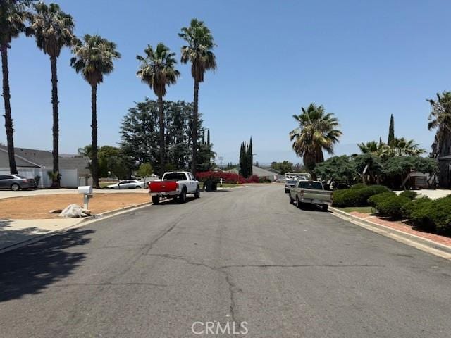 2089 Monterey Peninsula Dr, Corona, CA 92882 - view of asphalt road with curbs