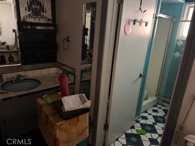 2089 Monterey Peninsula Dr, Corona, CA 92882 - bathroom featuring a shower stall and vanity