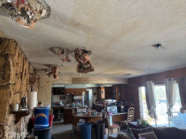 2089 Monterey Peninsula Dr, Corona, CA 92882 - dining room featuring a textured ceiling