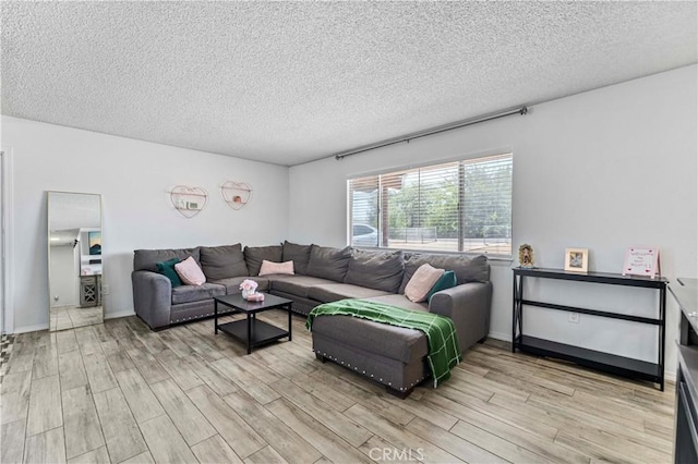 18396 Live Oak St, Hesperia, CA 92345 - living room featuring light wood-style floors and a textured ceiling