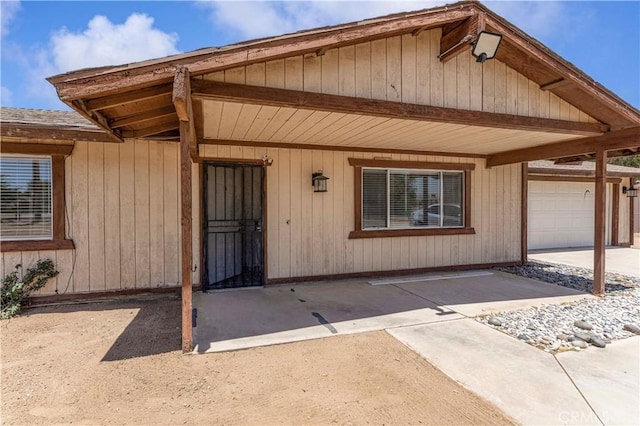 18396 Live Oak St, Hesperia, CA 92345 - property entrance with a garage and driveway
