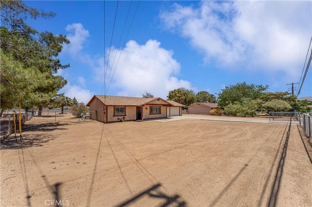 18396 Live Oak St, Hesperia, CA 92345 - view of front of house with driveway and an attached garage