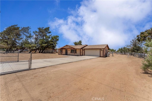 18396 Live Oak St, Hesperia, CA 92345 - view of front of house featuring an attached garage and concrete driveway
