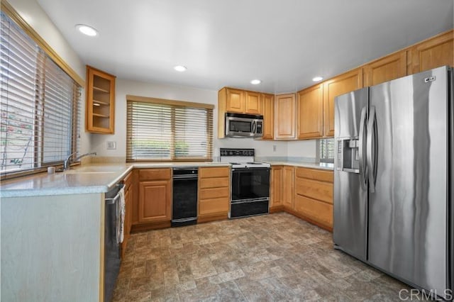 814 Cardamom Ct, Chula Vista, CA 91910 - kitchen featuring appliances with stainless steel finishes, recessed lighting, light countertops, glass insert cabinets, and stone finish flooring