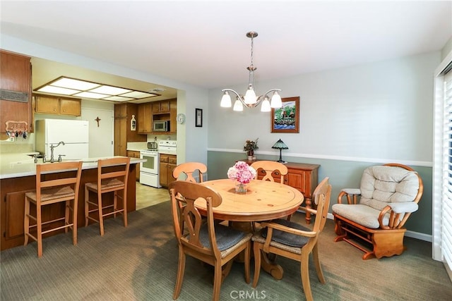 511 W Puente St Unit 4, Covina, CA 91722 - dining area featuring a chandelier and dark colored carpet