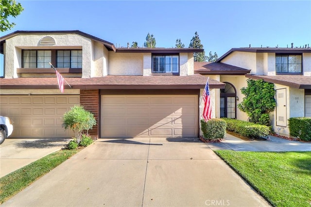 511 W Puente St Unit 4, Covina, CA 91722 - multi unit property with an attached garage, concrete driveway, and stucco siding