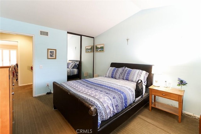 511 W Puente St Unit 4, Covina, CA 91722 - bedroom with vaulted ceiling, dark colored carpet, and a closet