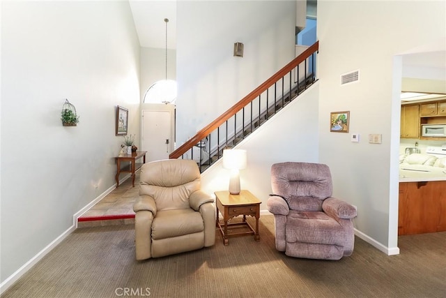 511 W Puente St Unit 4, Covina, CA 91722 - living area with a high ceiling, carpet, and stairway