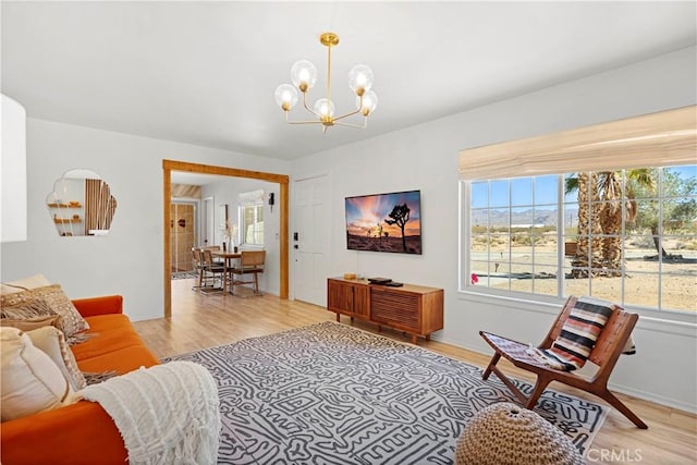 63608 Jadeite St, Joshua Tree, CA 92252 - living room with a chandelier and light wood-style floors