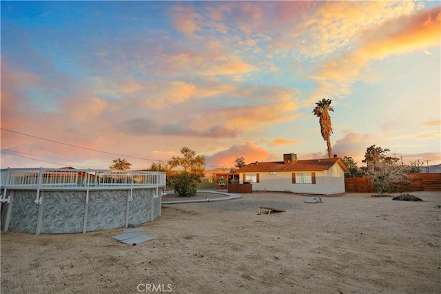 63608 Jadeite St, Joshua Tree, CA 92252 - yard at dusk featuring an outdoor pool