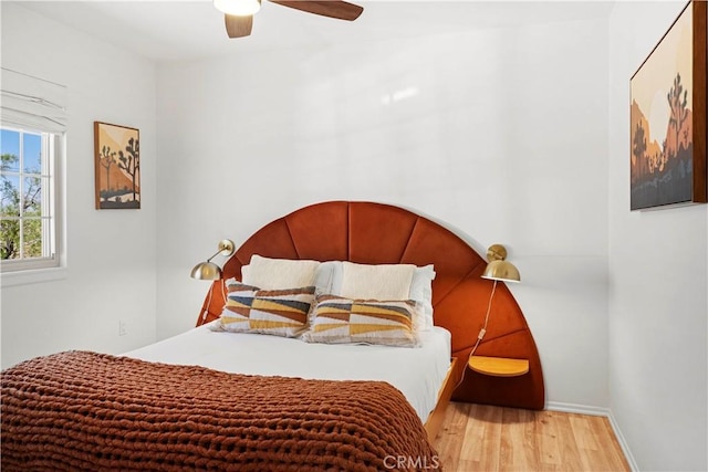 63608 Jadeite St, Joshua Tree, CA 92252 - bedroom with wood finished floors and a ceiling fan