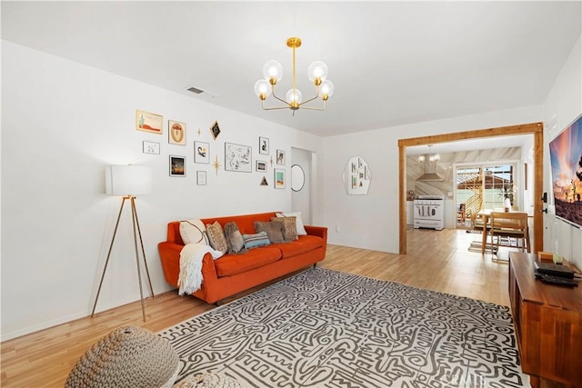 63608 Jadeite St, Joshua Tree, CA 92252 - living area with a chandelier and light wood-style floors