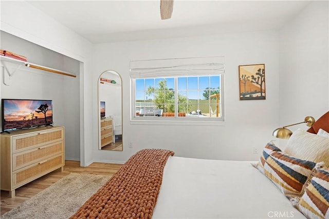 63608 Jadeite St, Joshua Tree, CA 92252 - bedroom with light wood finished floors and ceiling fan