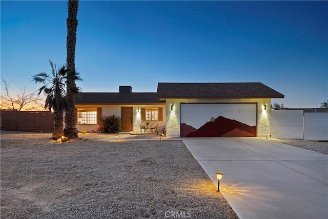 63608 Jadeite St, Joshua Tree, CA 92252 - ranch-style house featuring a garage, concrete driveway, and stucco siding