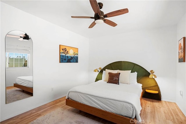 63608 Jadeite St, Joshua Tree, CA 92252 - bedroom with wood finished floors and a ceiling fan