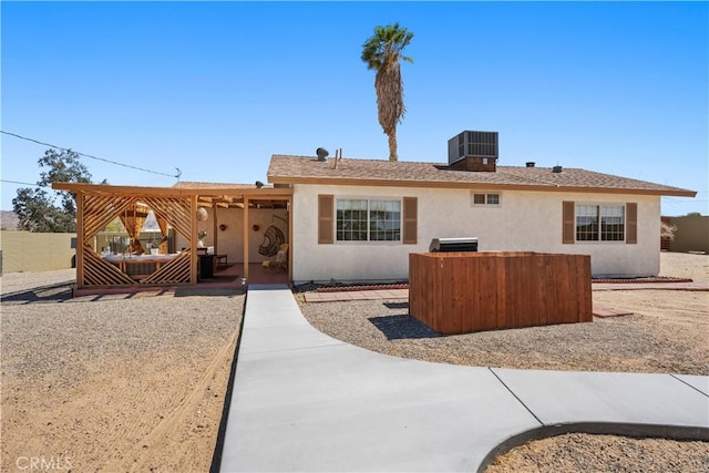 63608 Jadeite St, Joshua Tree, CA 92252 - rear view of property featuring stucco siding and a patio area