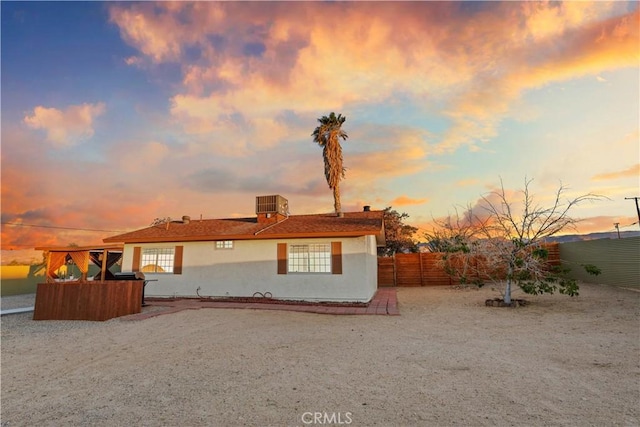 63608 Jadeite St, Joshua Tree, CA 92252 - back of property with a fenced backyard and stucco siding