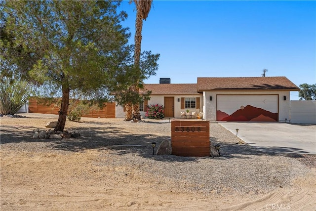 63608 Jadeite St, Joshua Tree, CA 92252 - single story home featuring an attached garage, concrete driveway, and stucco siding