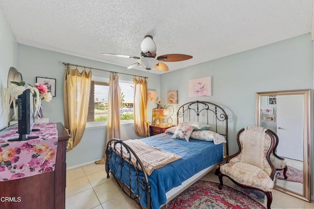 130 E Bay Blvd, Port Hueneme, CA 93041 - bedroom featuring light tile patterned flooring, ceiling fan, and a textured ceiling