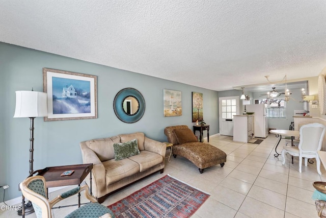 130 E Bay Blvd, Port Hueneme, CA 93041 - living room with light tile patterned flooring and a textured ceiling