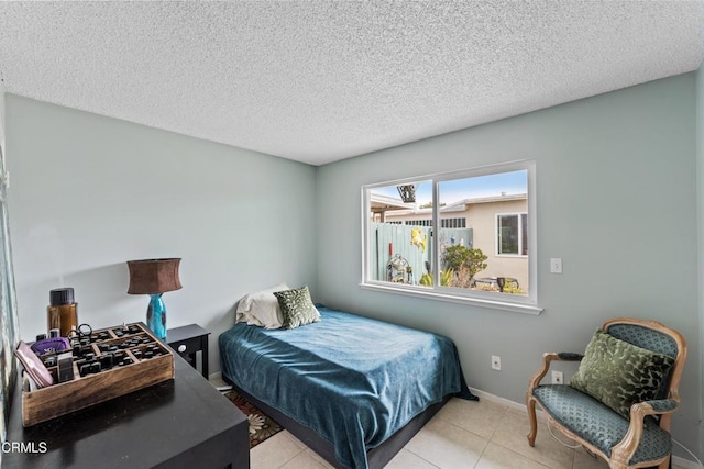 130 E Bay Blvd, Port Hueneme, CA 93041 - bedroom with light tile patterned floors and a textured ceiling