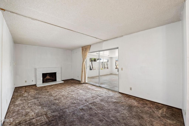 1921 Lincoln Ct, Oxnard, CA 93033 - unfurnished living room with a textured ceiling, carpet flooring, and a fireplace