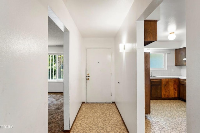 1921 Lincoln Ct, Oxnard, CA 93033 - corridor with light floors and a sink