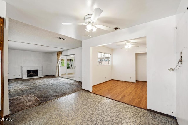 1921 Lincoln Ct, Oxnard, CA 93033 - unfurnished living room with ceiling fan, a fireplace, and tile patterned floors