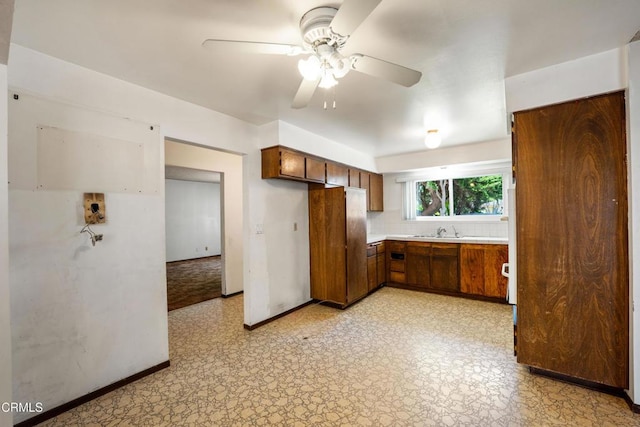 1921 Lincoln Ct, Oxnard, CA 93033 - kitchen featuring a ceiling fan, light countertops, light floors, and brown cabinets