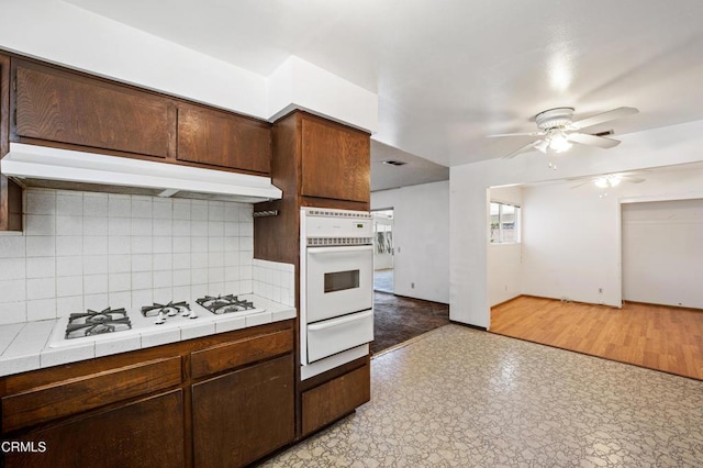 1921 Lincoln Ct, Oxnard, CA 93033 - kitchen with a warming drawer, white appliances, tile counters, ceiling fan, and backsplash