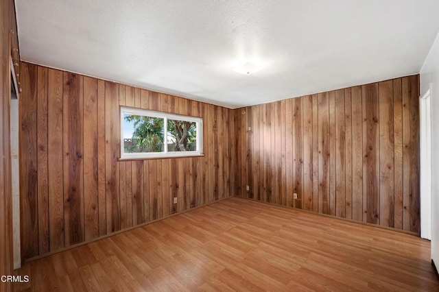 1921 Lincoln Ct, Oxnard, CA 93033 - spare room with wood finished floors and wood walls