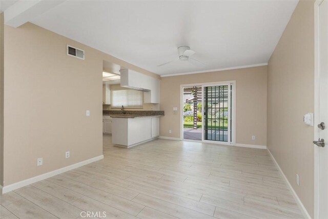 2692 N Fernside St, Orange, CA 92865 - unfurnished living room with a ceiling fan and light wood-type flooring
